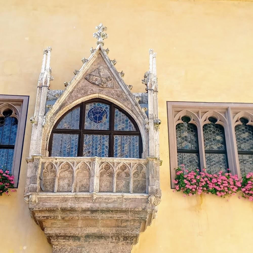 Ornate balcony with arched window, New Town Hall, Munich.